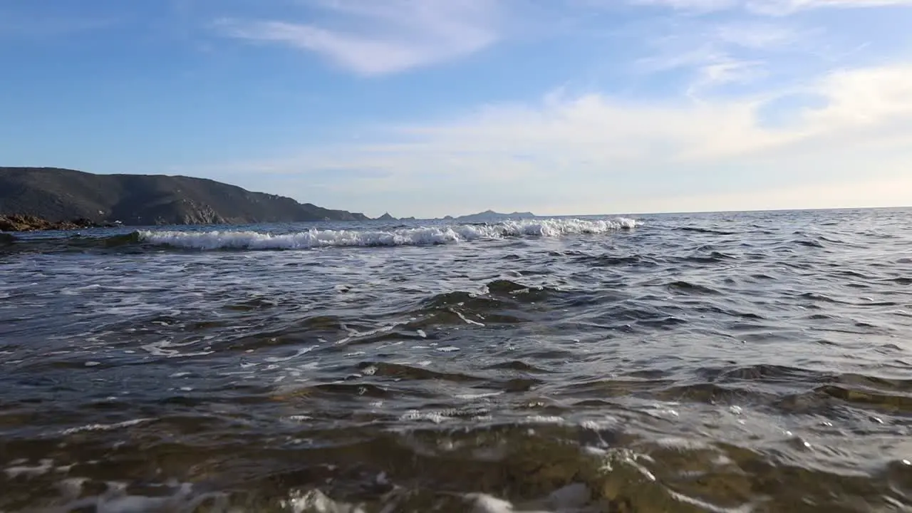 POV shot of person walking into the mediterranean sea