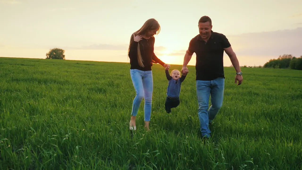 A Young Couple Is Having Fun With Their Young Child In A Picturesque Place 2