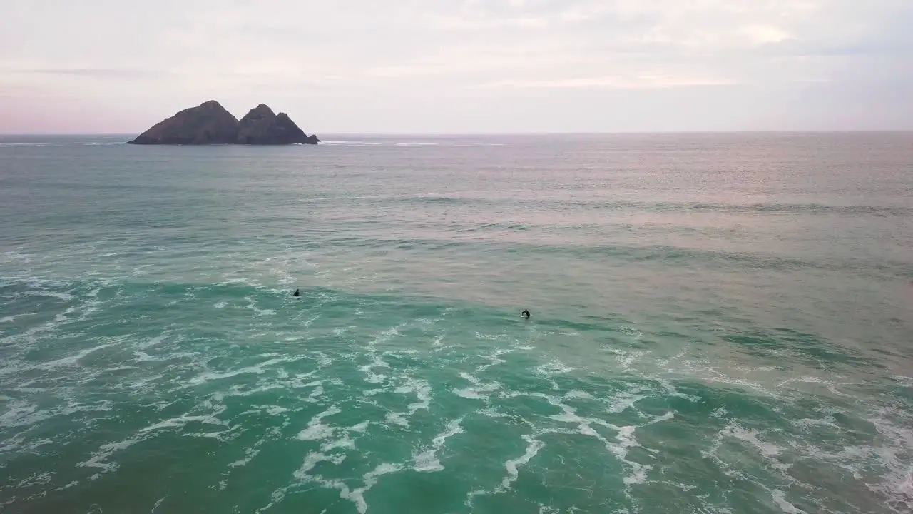 Surfers waiting to catch a wave in a calm period of sea movement