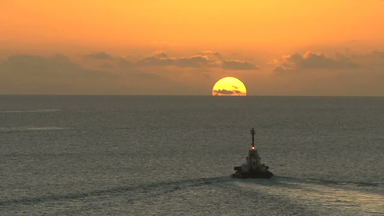 Bonaire tugboat and setting sun