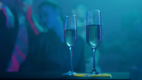 Champagne glasses in the disco