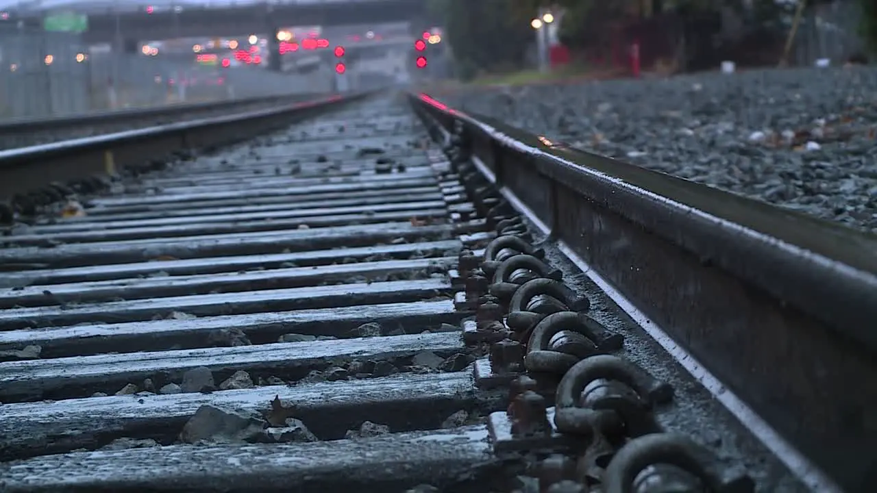 EMPTY URBAN RAILROAD TRACKS IN THE RAIN