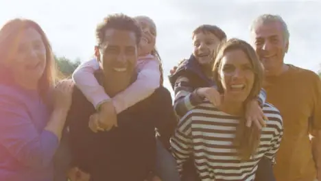 Low Angle Shot of Children Piggy Backing On Their Parents 03