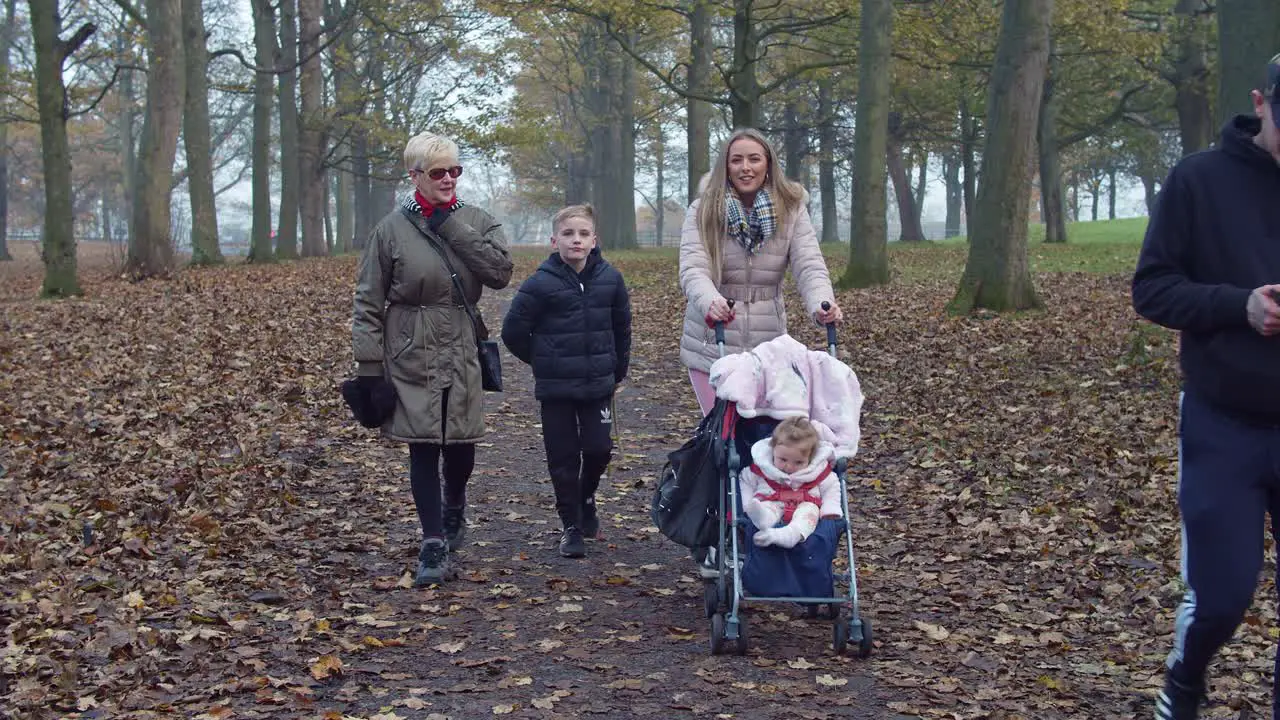 Family walking in park Static shot