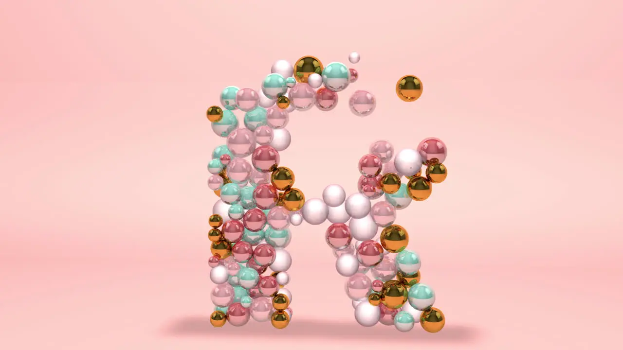 Letter R made of beads glass balls pastel pearls crystal jewels and gold