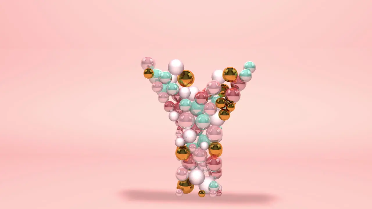 Letter Y made of beads glass balls pastel pearls crystal jewels and gold