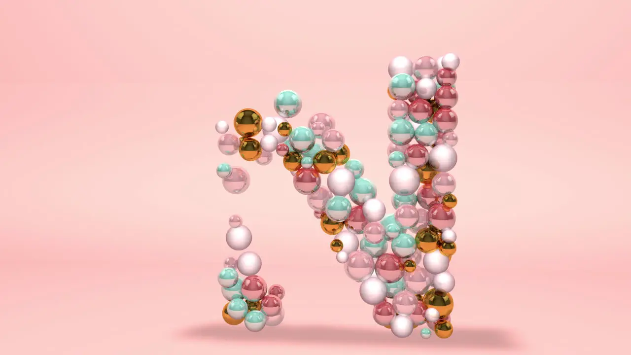 Letter N made of beads glass balls pastel pearls crystal jewels and gold