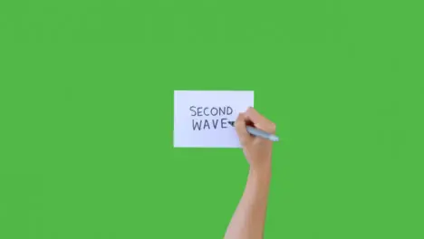 Woman Writing Second Wave on Paper with Green Screen