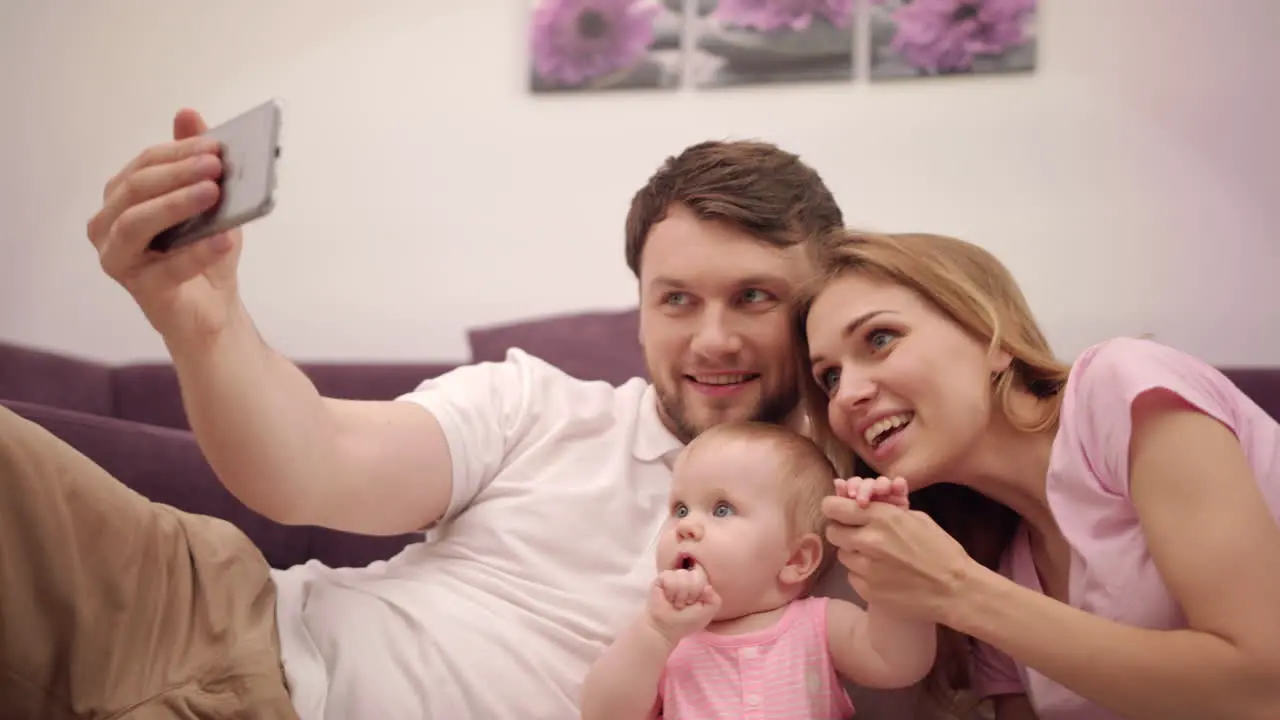 Selfie photo in family home Man taking photo with happy family