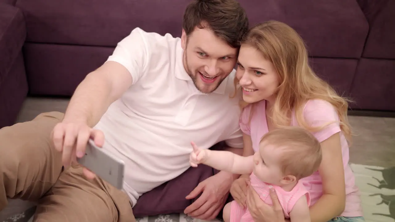 Self photo of happy family with little baby Togetherness family portrait