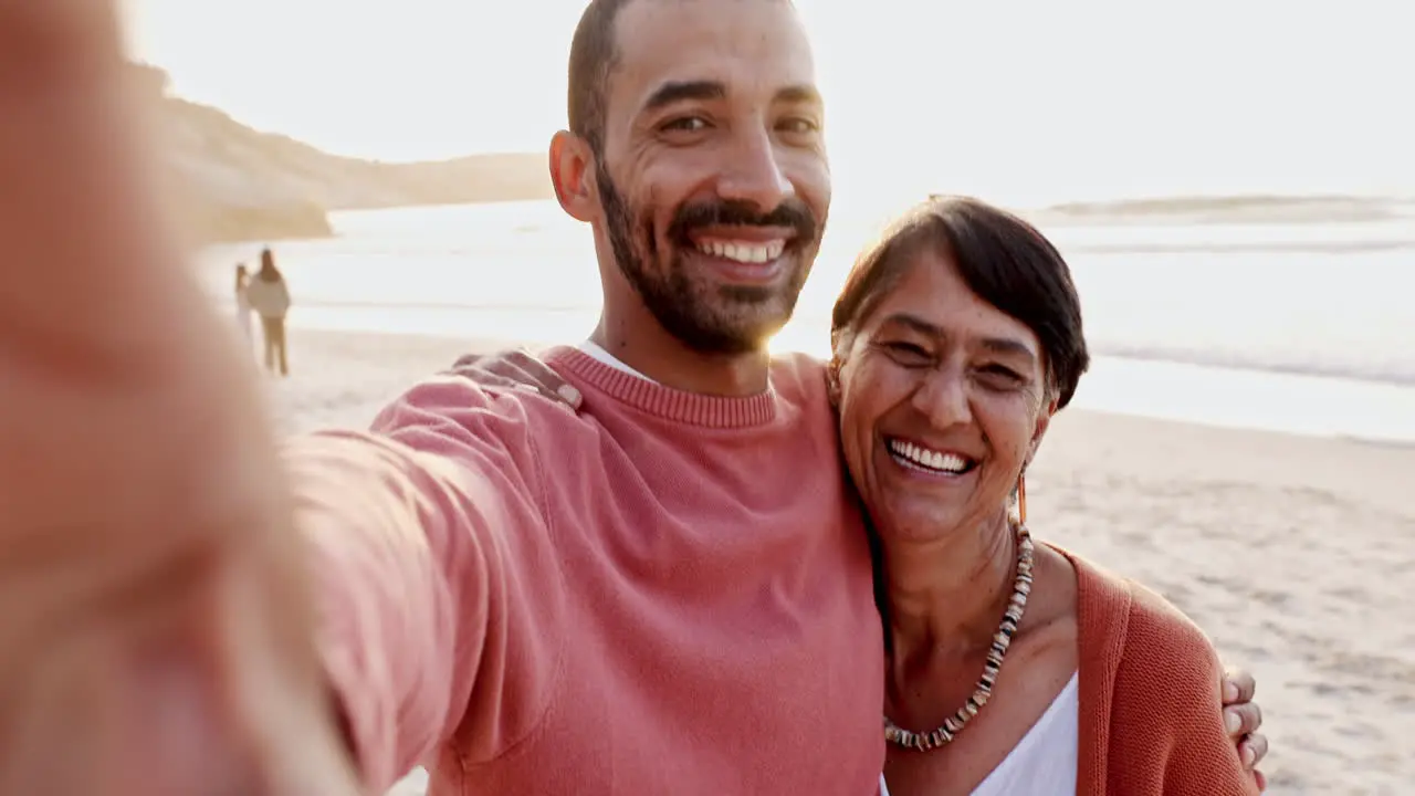 Man senior mom and beach selfie with hug