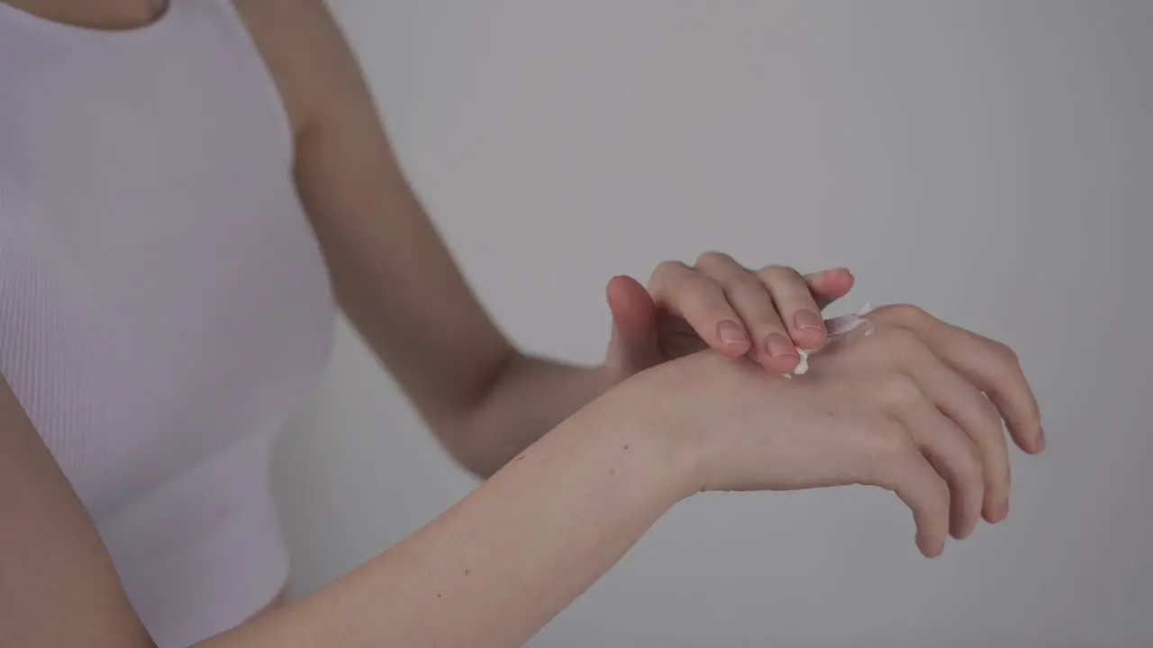 Detail Of A Woman's Hands Applying Cream To The Hands 1