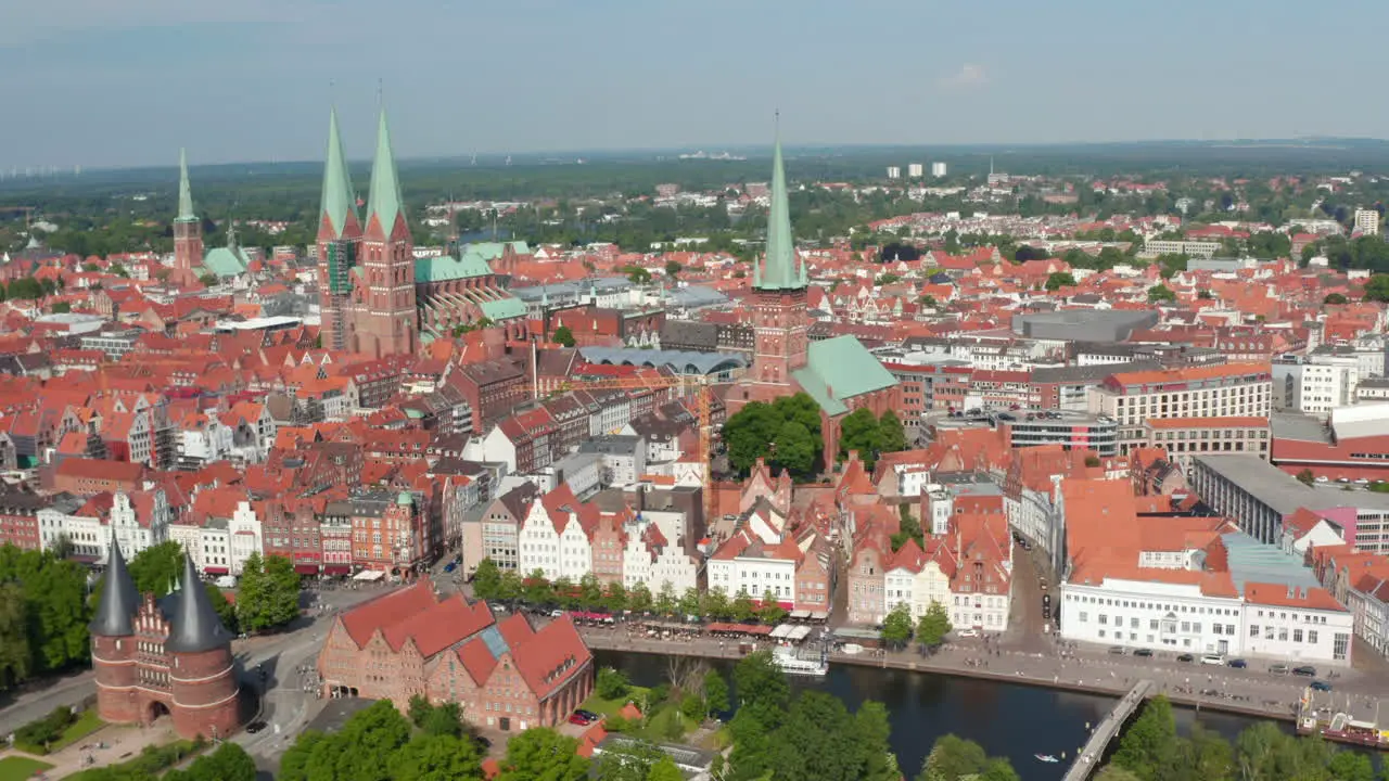 Aerial panoramic view of medieval city centre Brick gothic landmarks Holsten Gate St Marys and St Peters churches Luebeck Schleswig-Holstein Germany