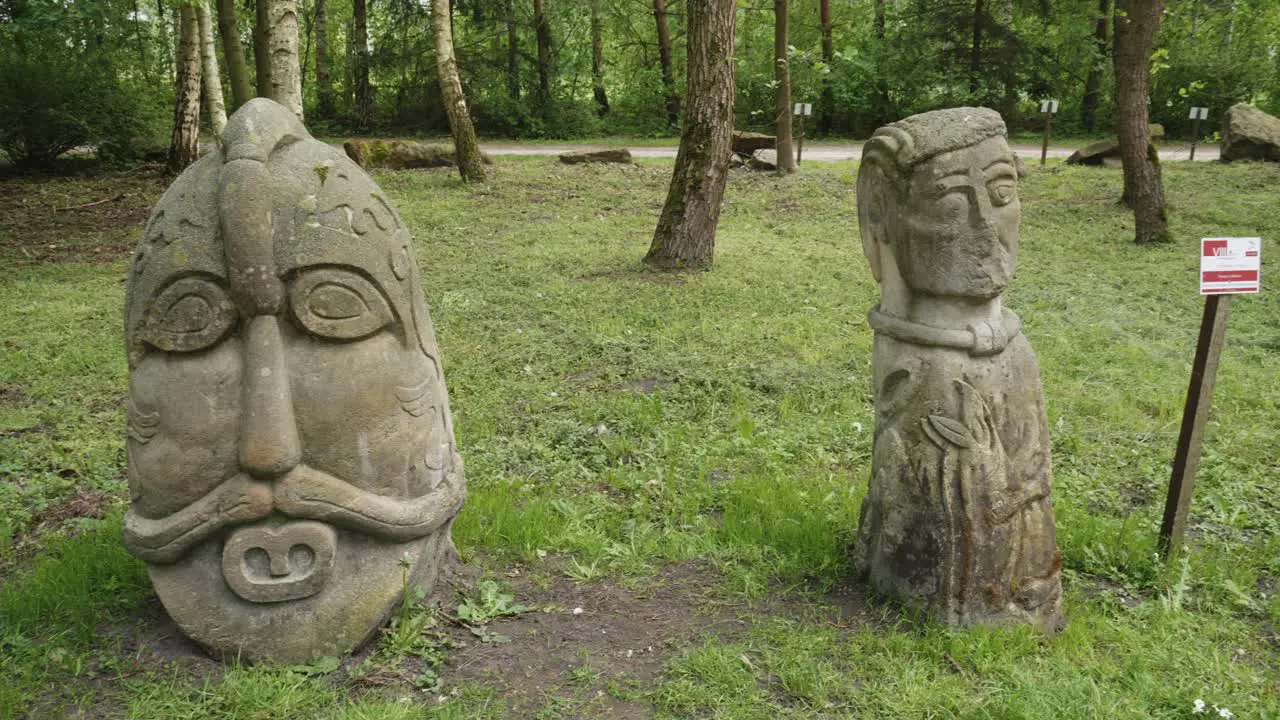 Historic Slavic sculptures in natural woodland setting