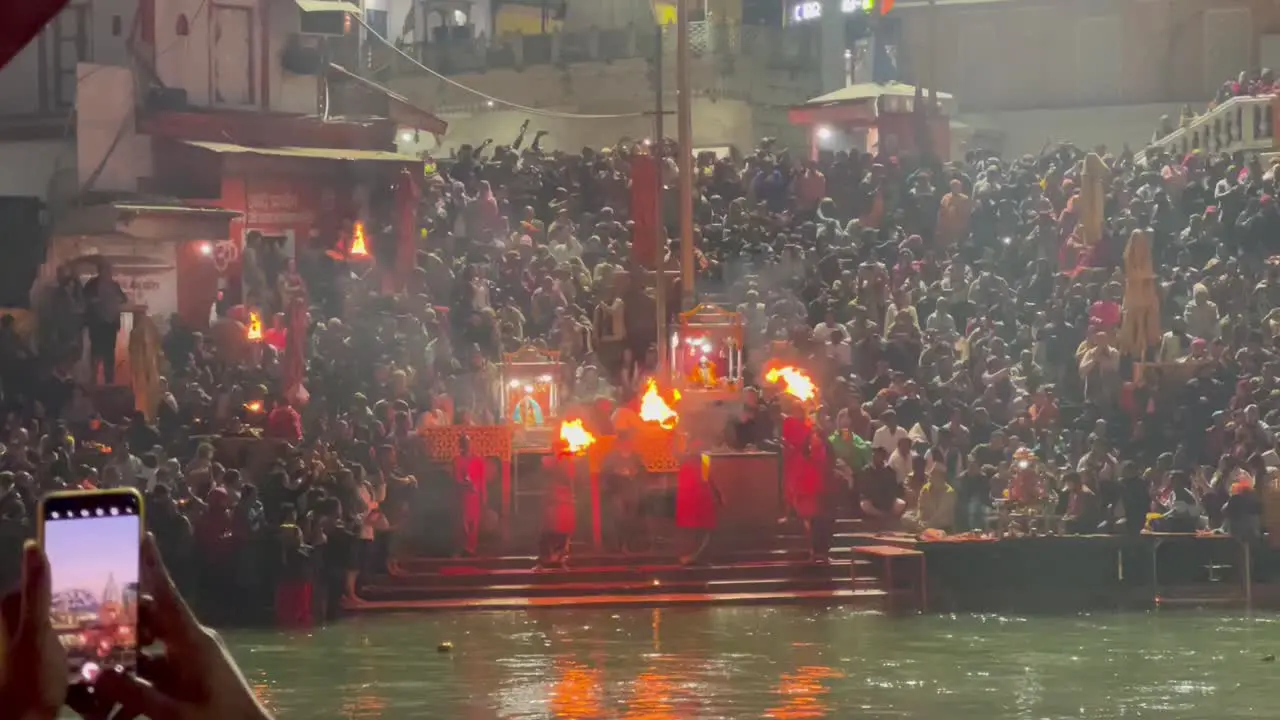 pov shot Many people are watching Ganga Aarti and are getting happy