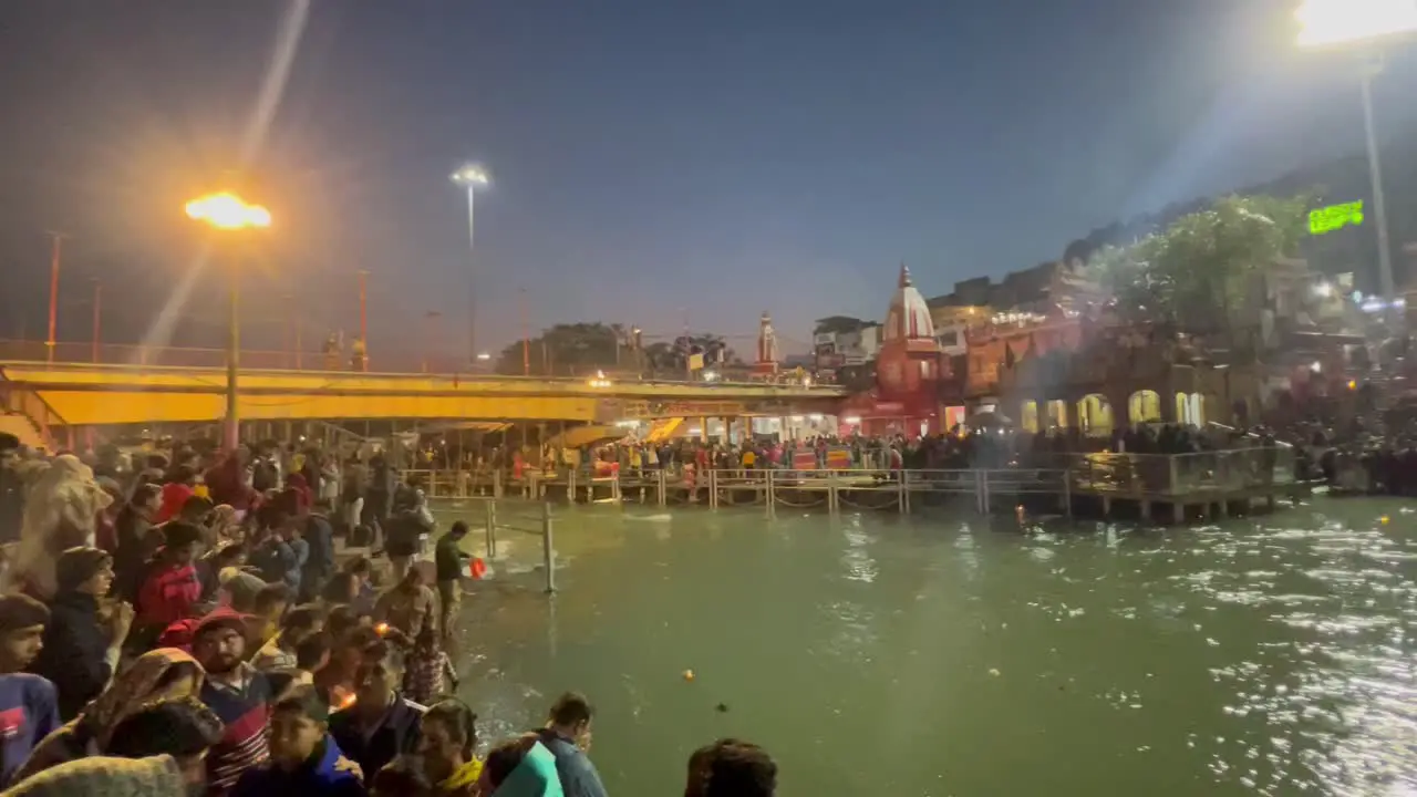 pov shot Many people are looking at the temple and many people are doing aarti