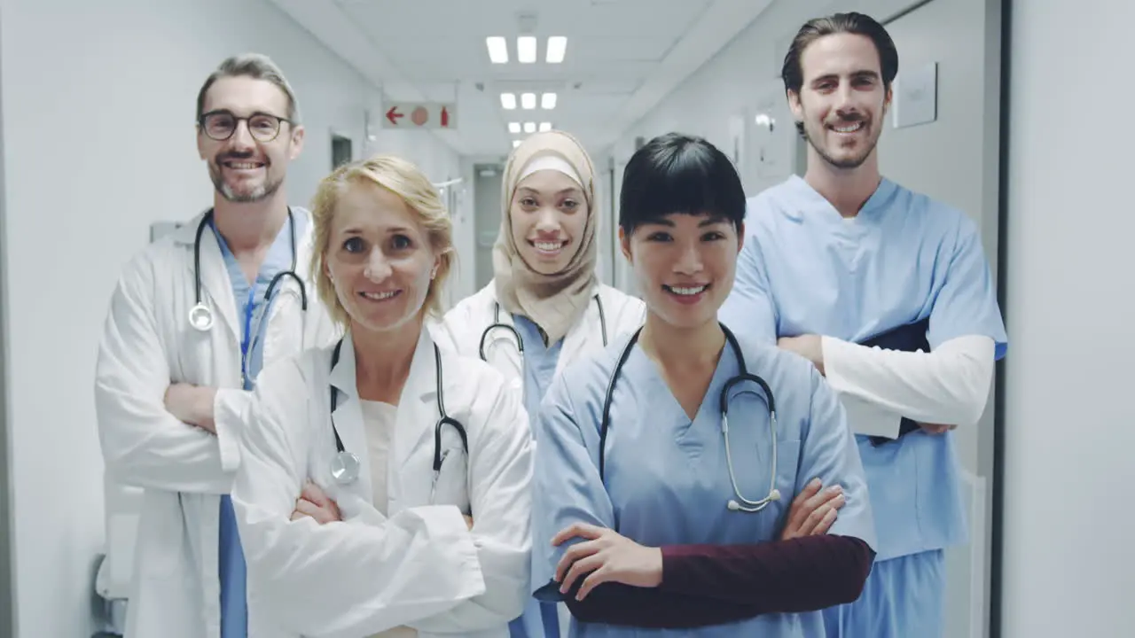 Group of young doctors standing in corridor 4k