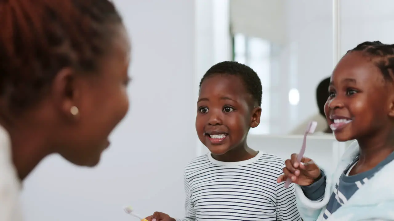 Mother children and check for brushing teeth