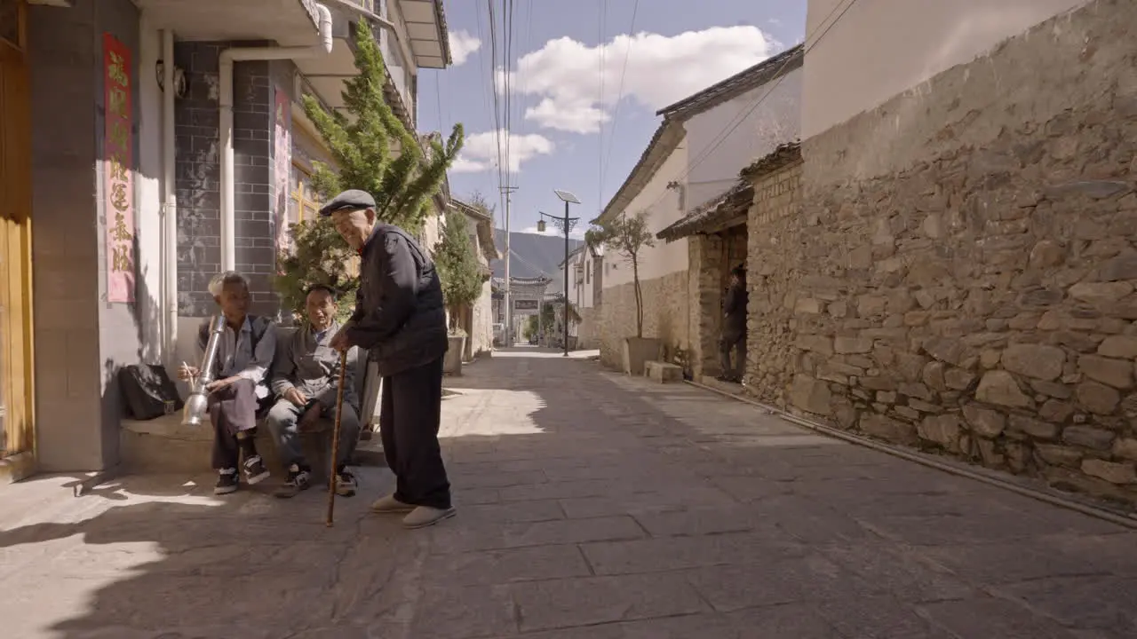 Ethnic Minority People Smoking in Village in Yunnan China