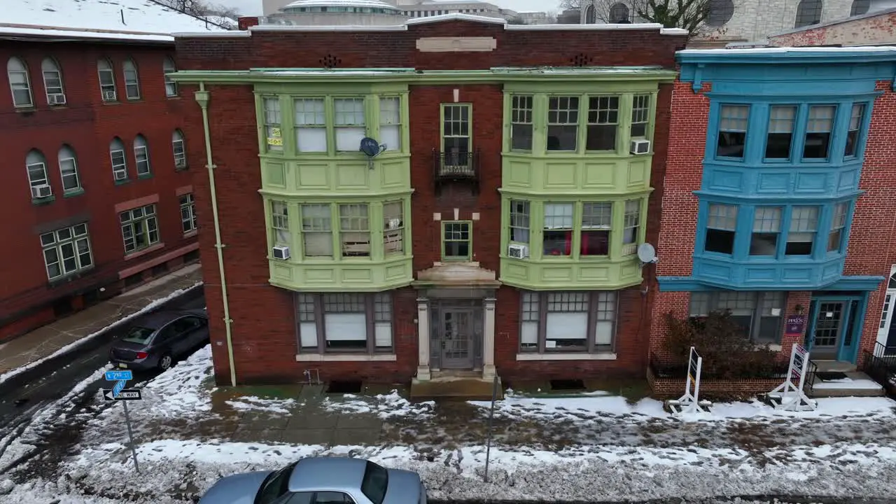 Colorful rowhouses in snowy city in USA