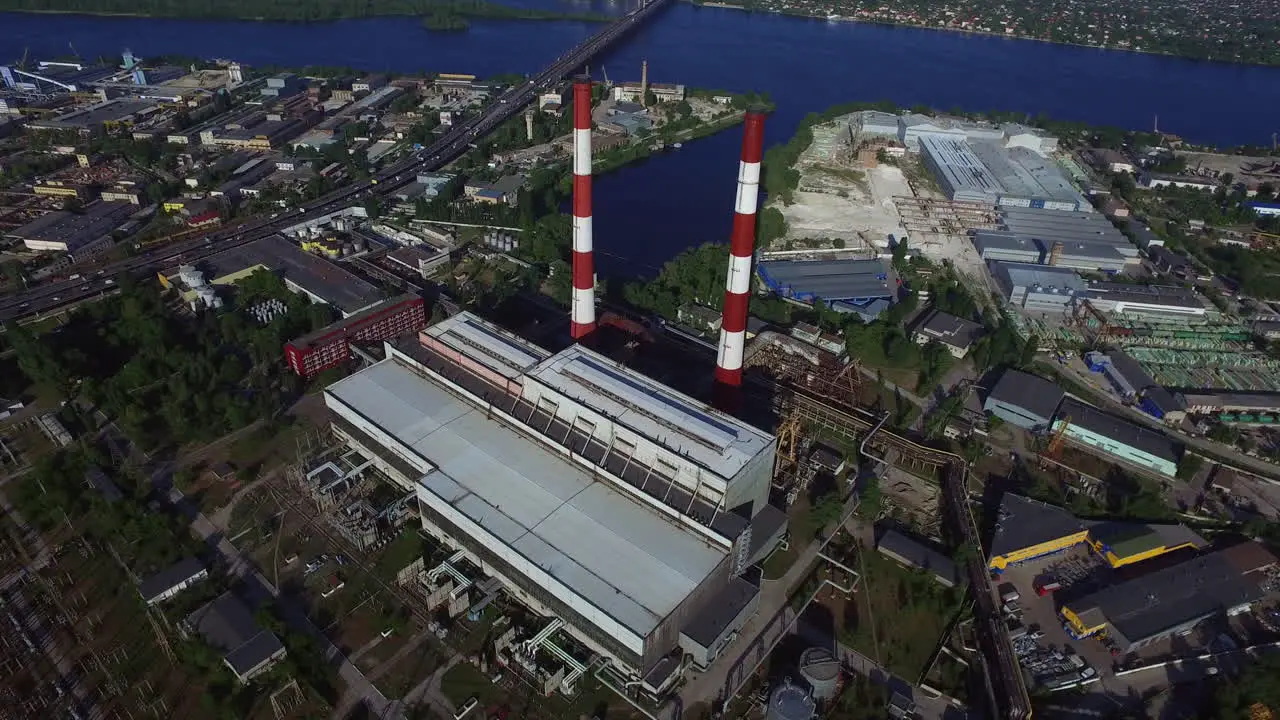 Industrial chimneys on hydro power station Aerial view pipe water power plan