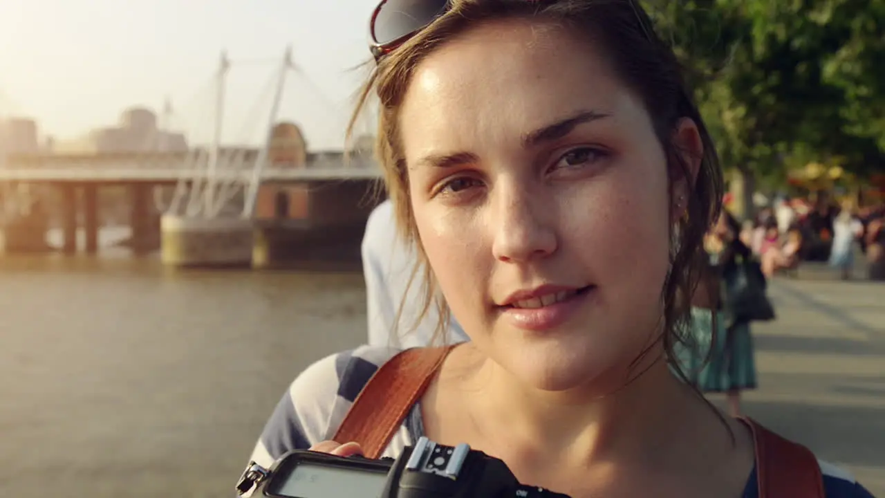 Portrait of young woman photographer