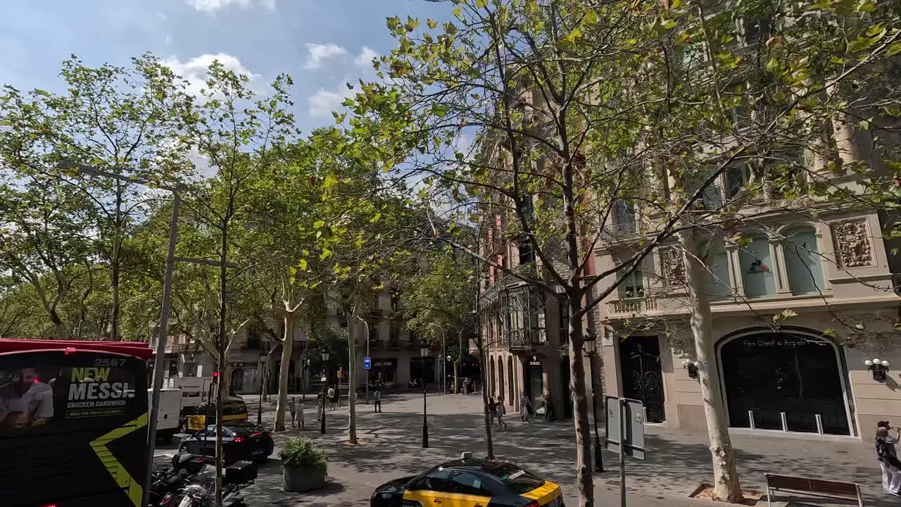 Buildings and traffic view while City tour around the city of Barcelona by bus Spain