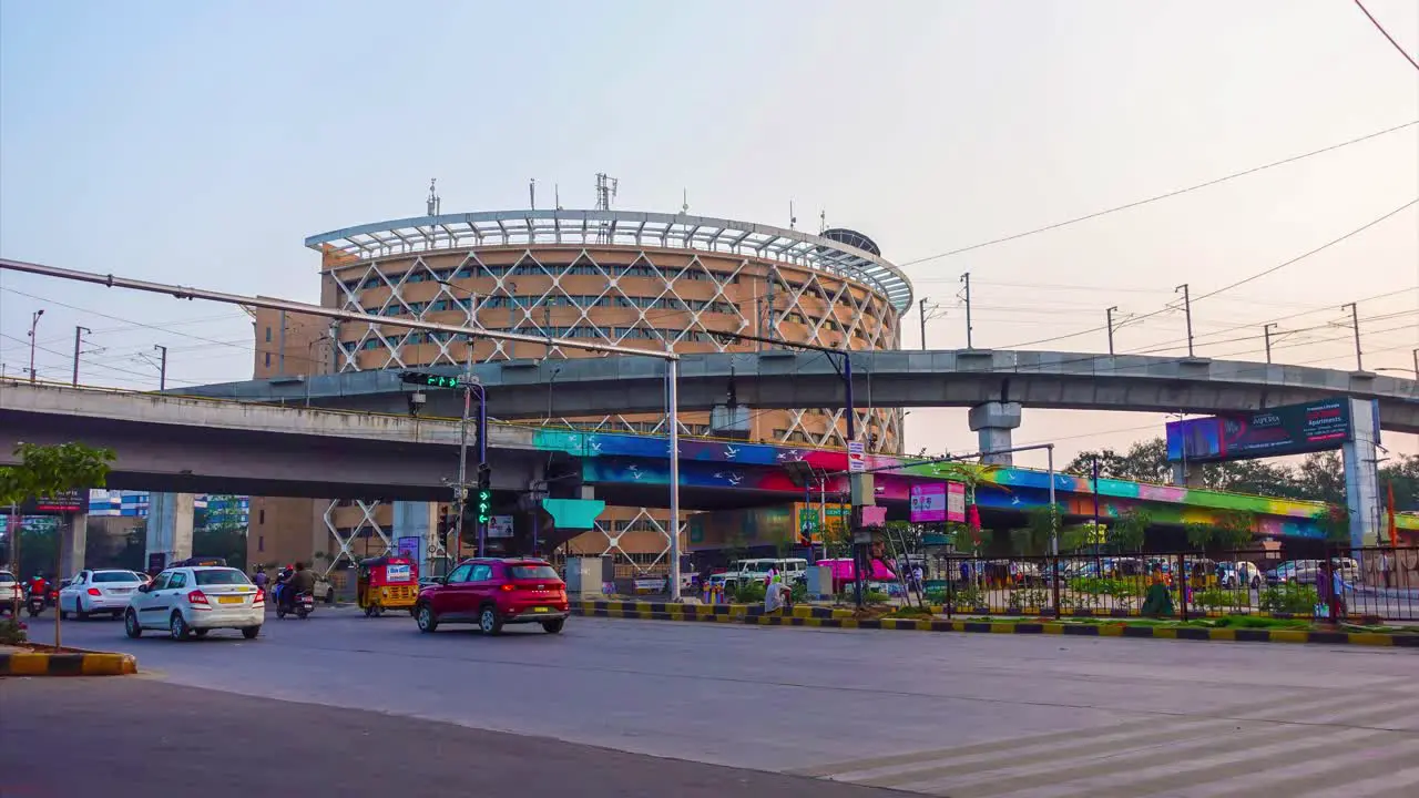 Time lapse on the beautiful high tech city Hyderabad capital of Telangana State  of high building in front of the bridge and the people in vehicles moving on the road