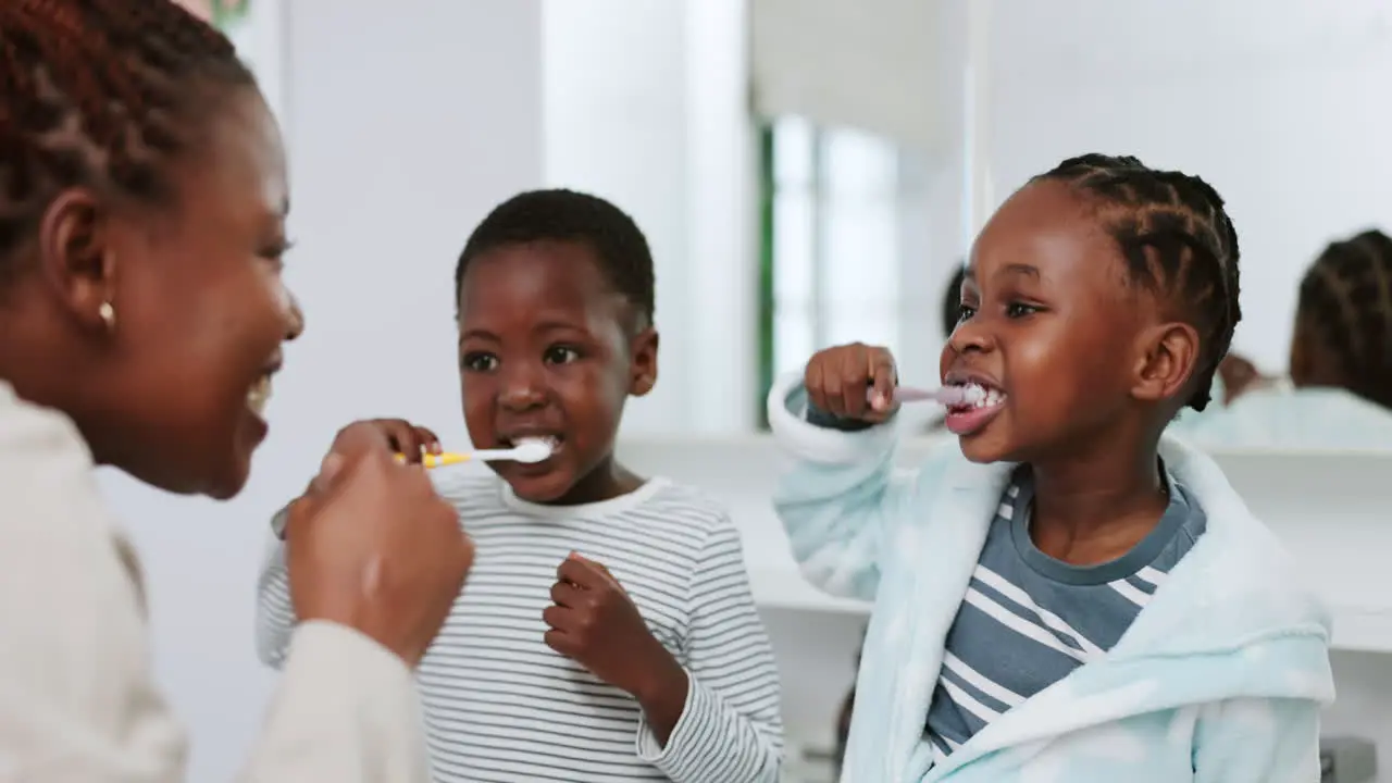 African mother kids and brushing teeth