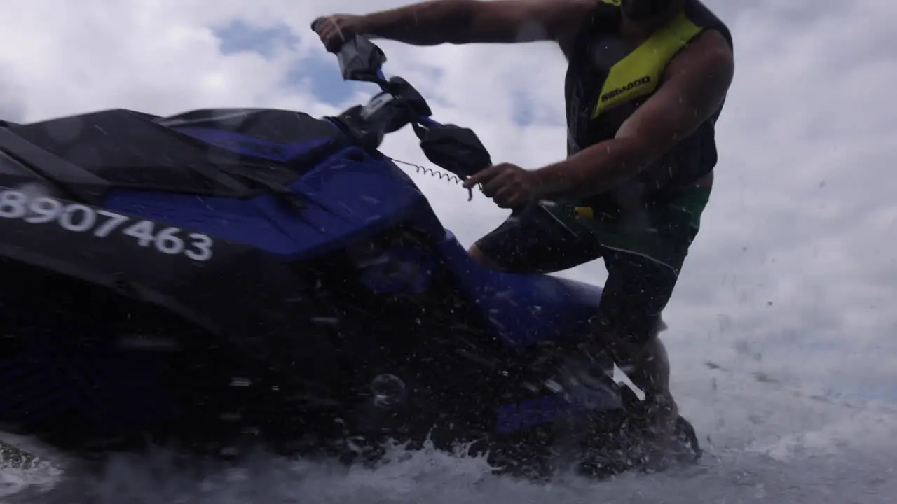 Jet ski rider spinning away from camera extreme sports motorsport