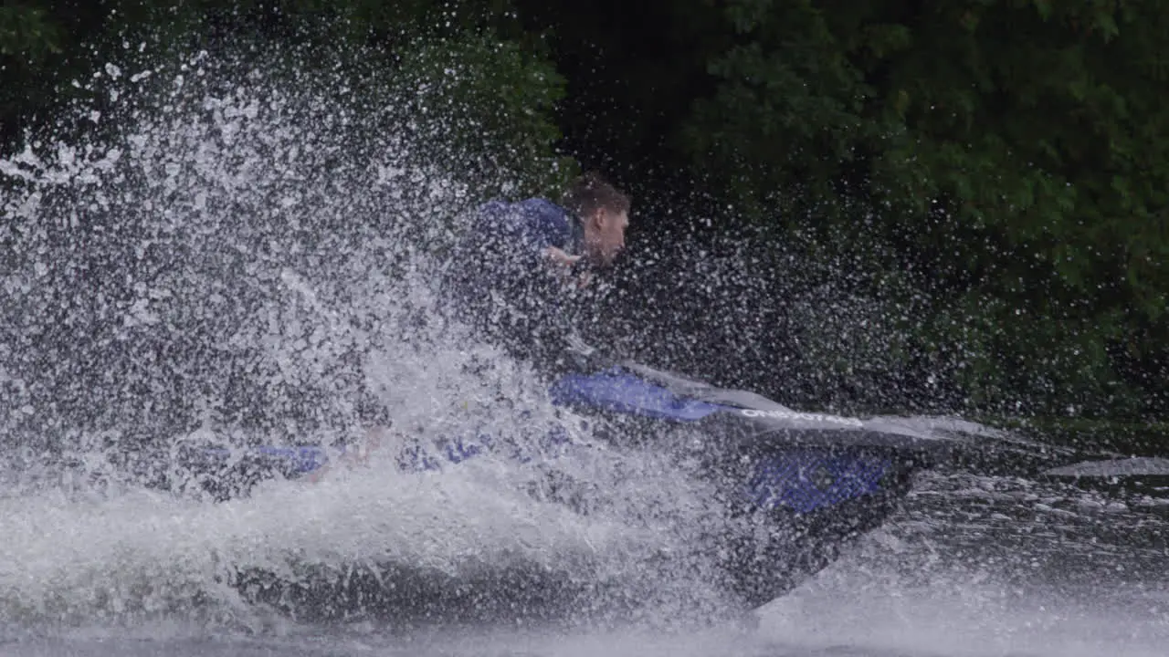 Extreme sports jet ski splashing in river