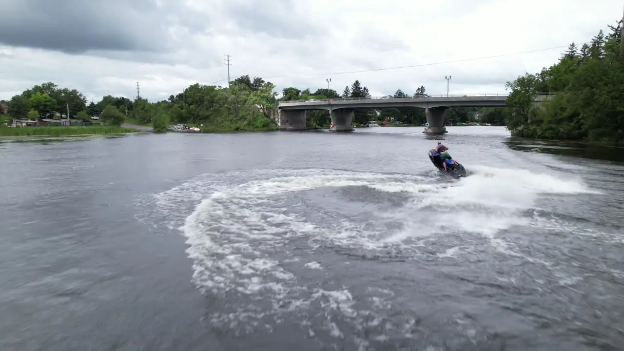 Blue jetski carving the waves aerial