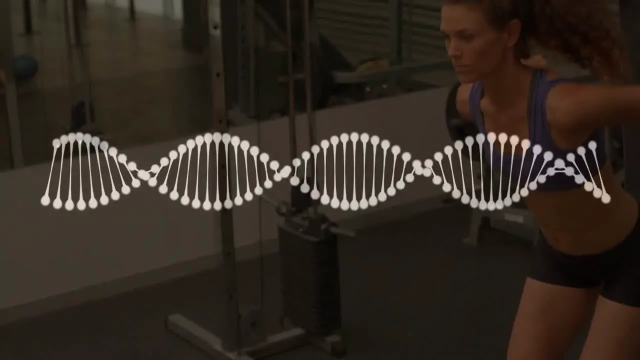 Animation of dna strand over strong woman exercising in gym