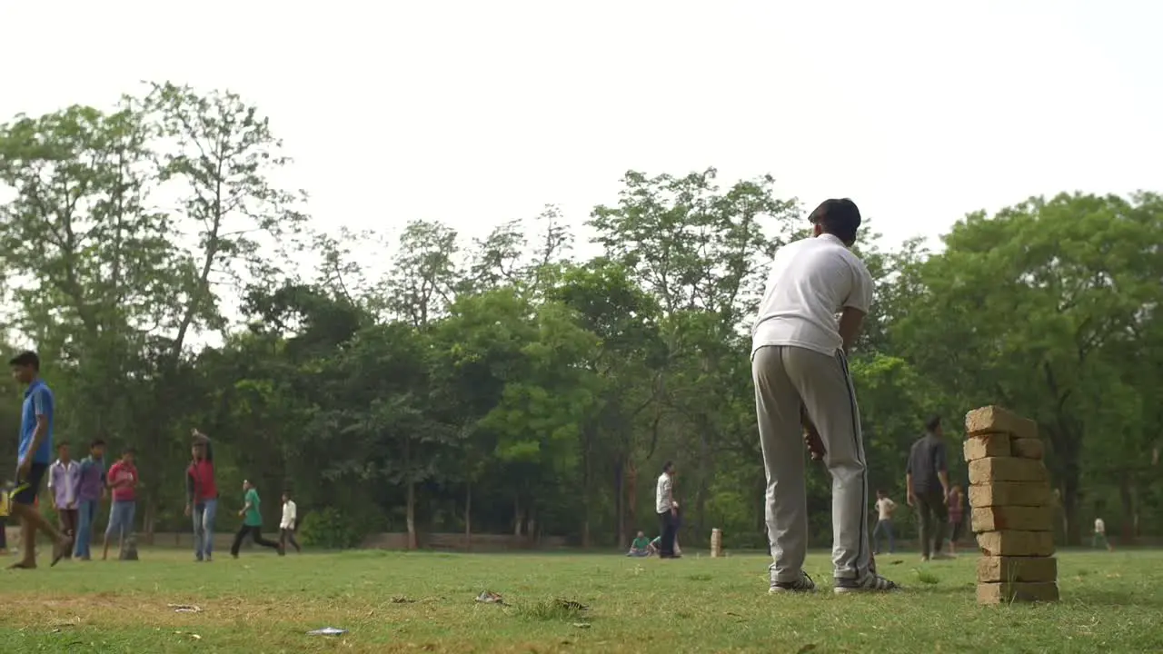 Man Batting in a Cricket Game in India