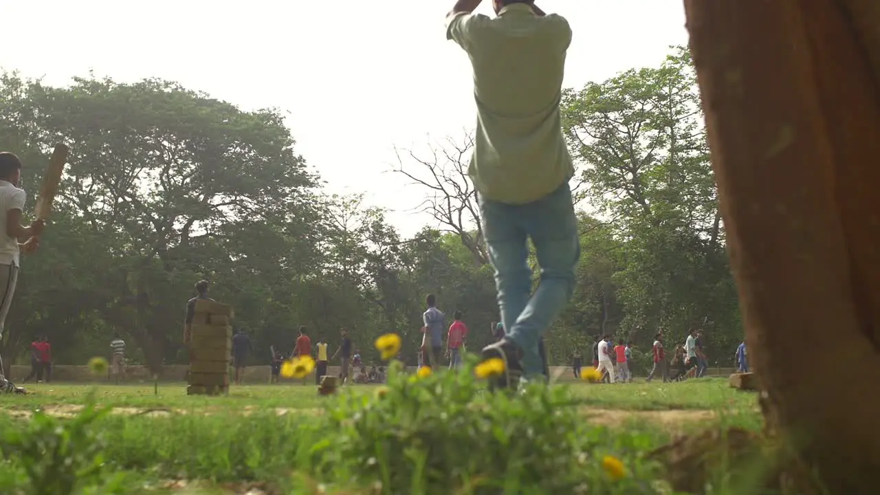 Panning Shot of People Playing Cricket