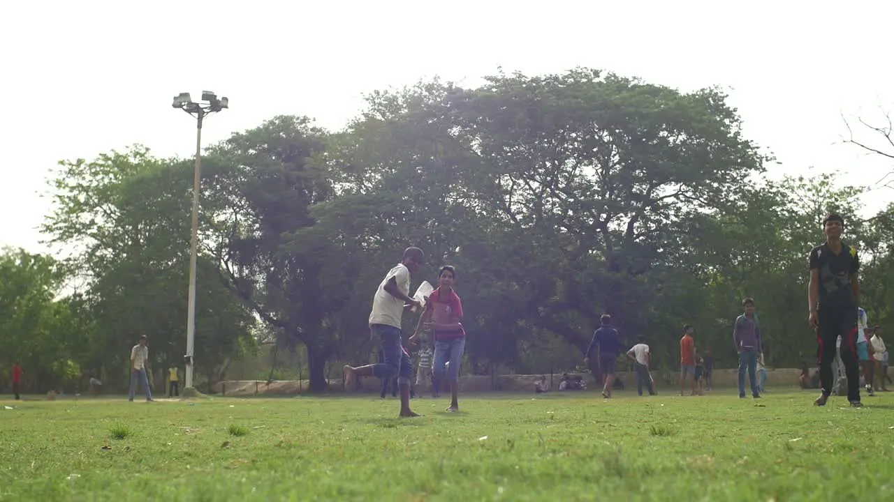 Boy Hits a Cricket Ball With a Bat