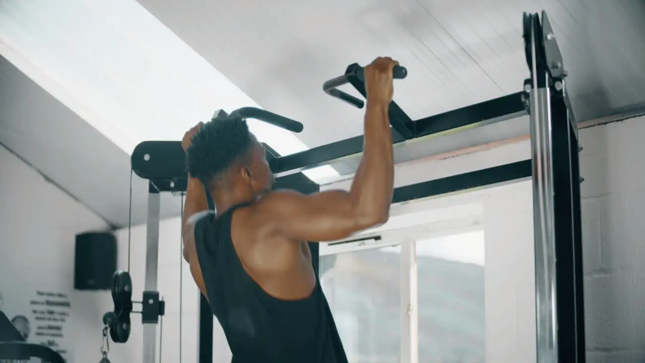 Man Doing Pull Ups in Gym