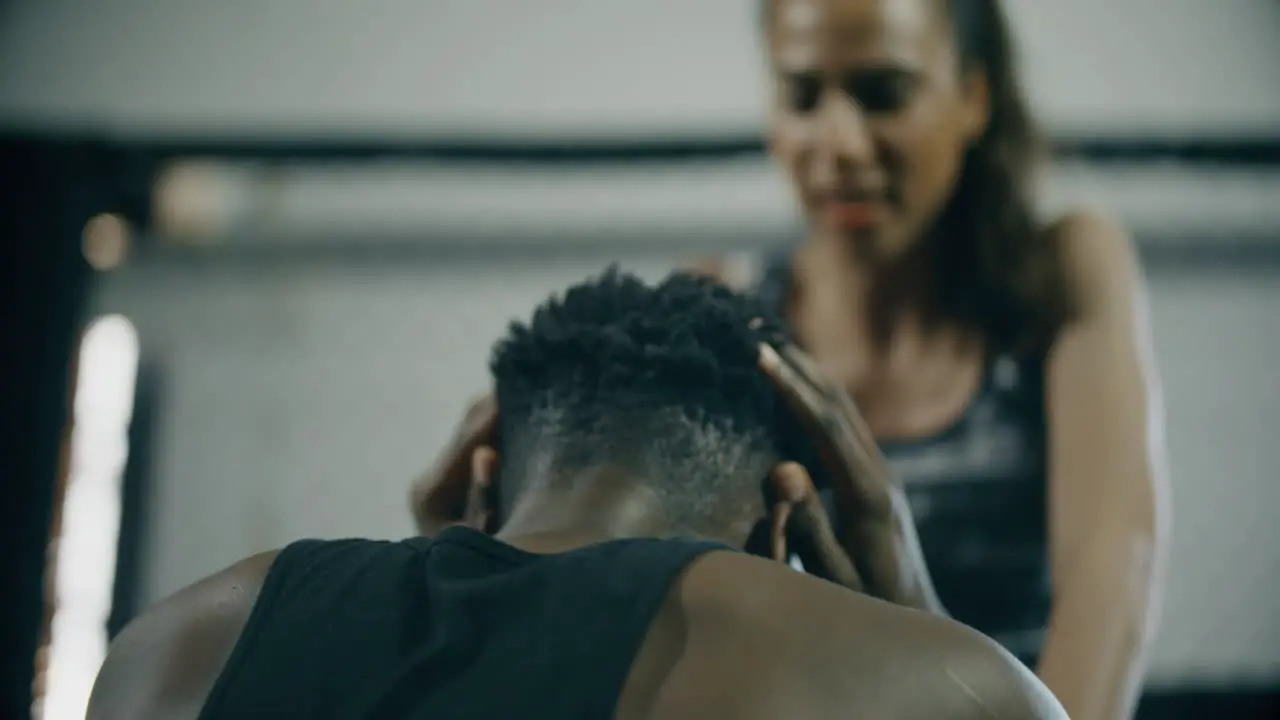 Man Doing Sit Ups With Personal Trainer