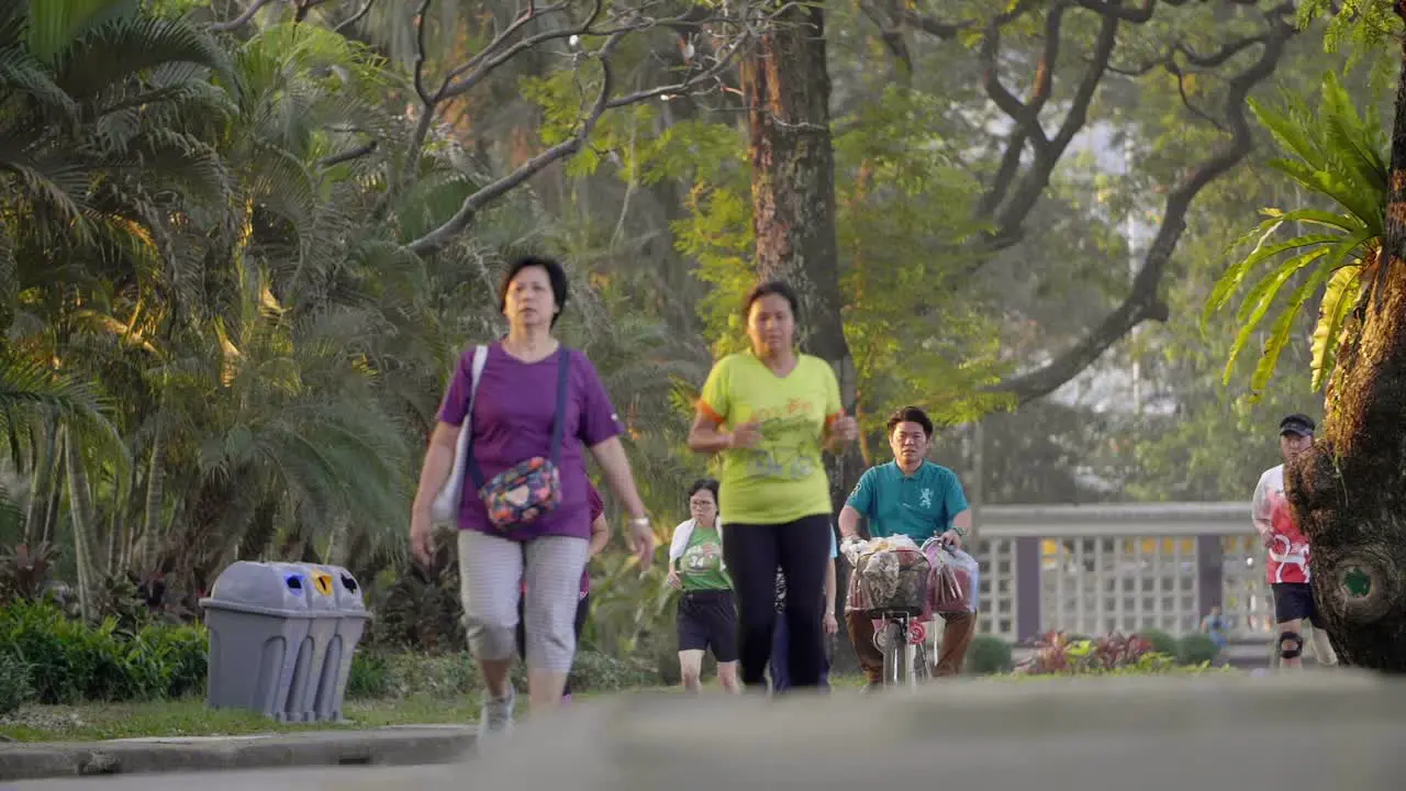 Joggers and Cyclist in a Park