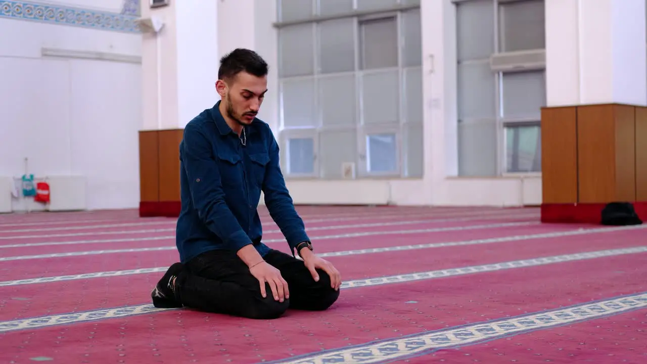 Muslim Man Praying Places His Forehead On The Ground 1