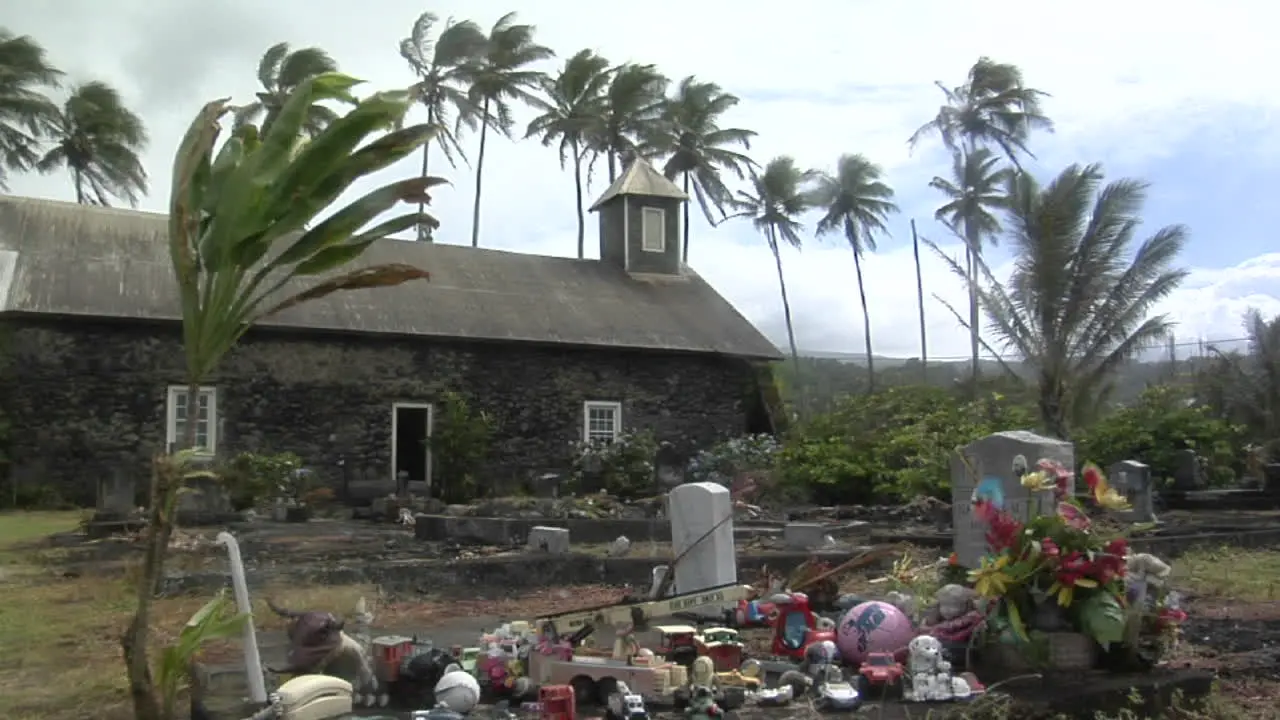 Wind Blows Over A Heavily Decorated Grave On A Tropical Island