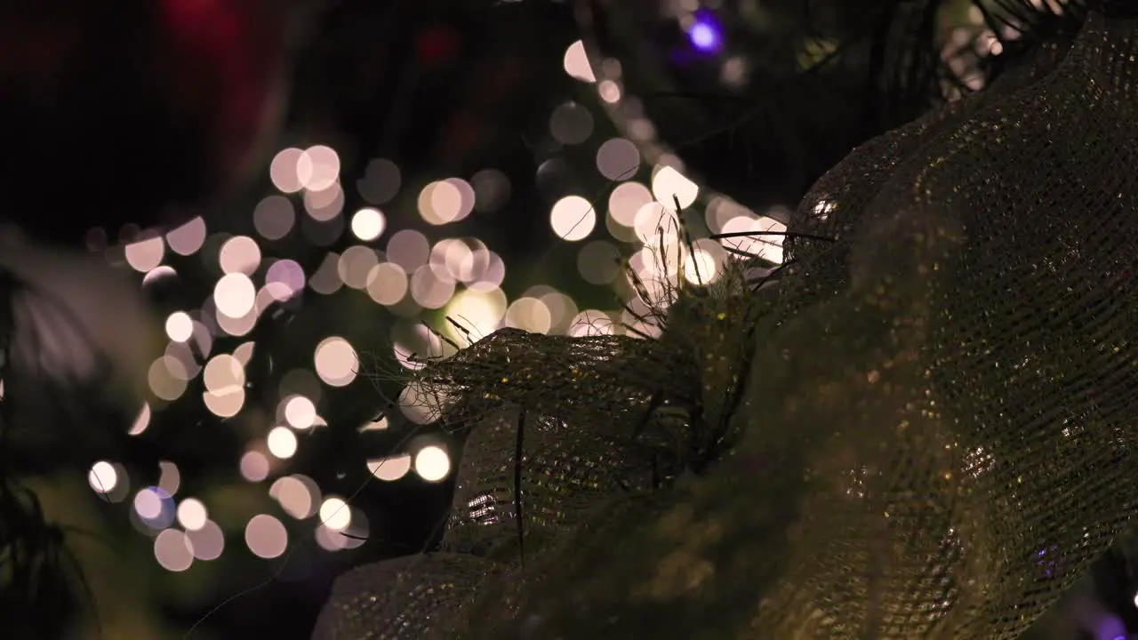 Glowing Christmas Lights Out of Focus Blinking With Ribbon Decoration and Ornaments Abstract Background