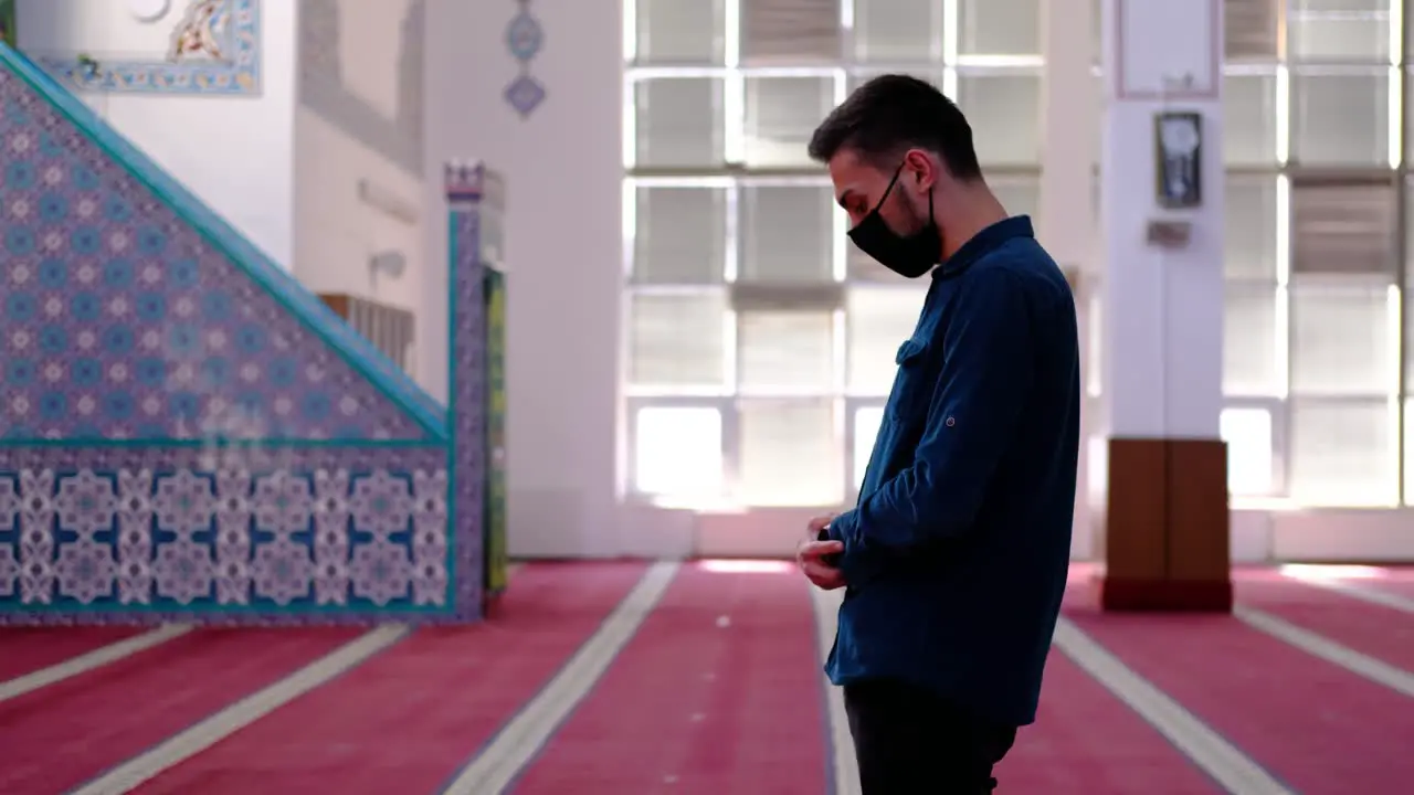 Masked Young Muslim Worships In Masjid