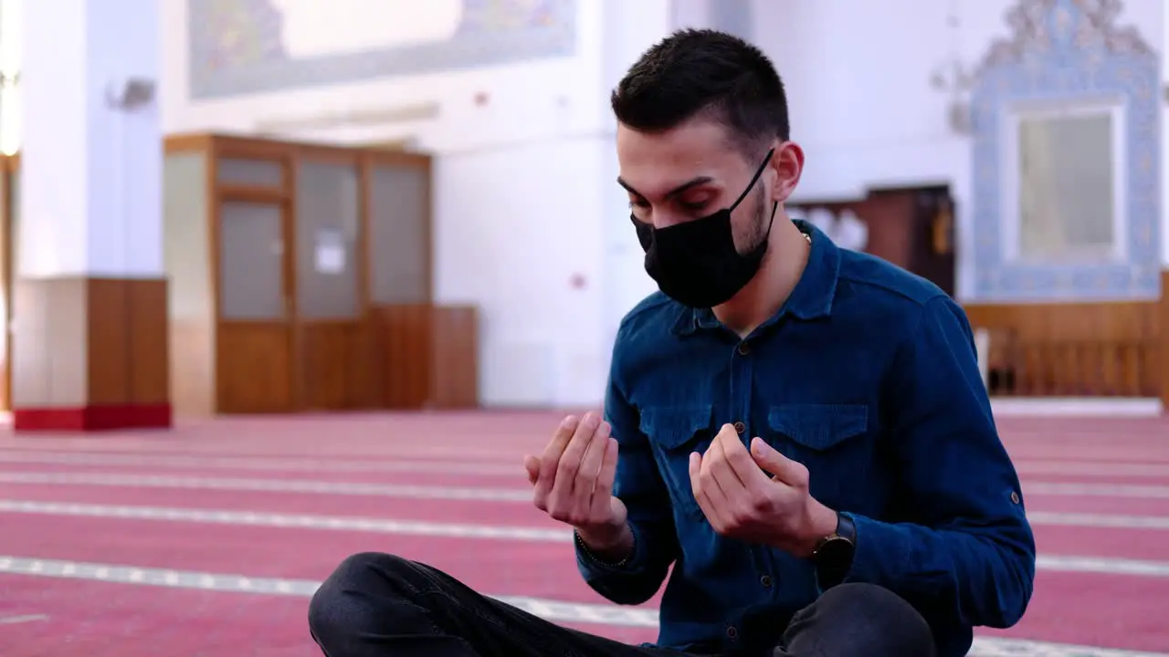 Young Muslim Praying In Mask Due To Coronavirus