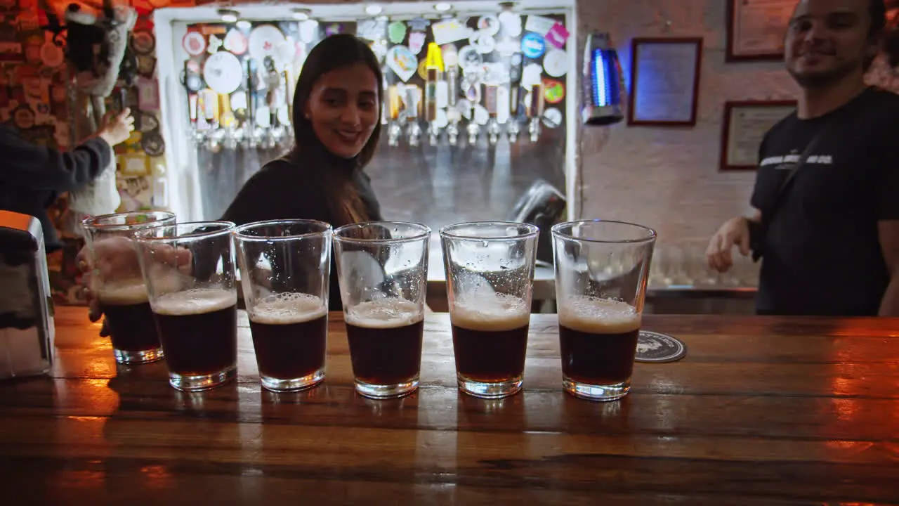 Shot of beers being served at the bar in Barrio Escalante in Costa Rica