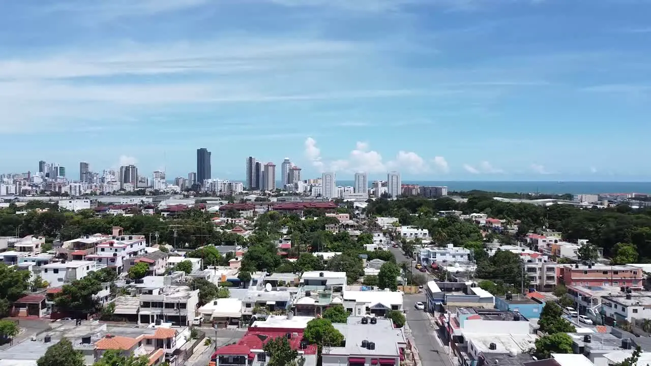 drone view from high above houses in the residential area in santo domingo beautiful sunny day