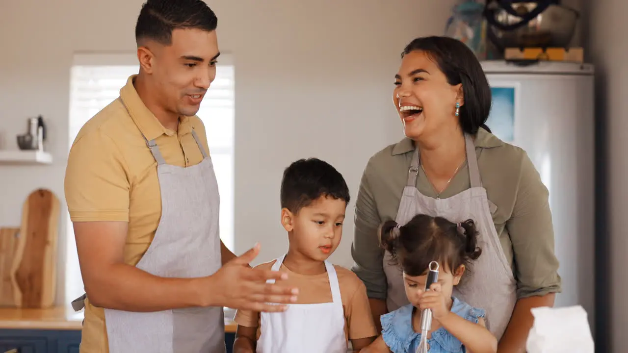 Family home laughing and kitchen cooking