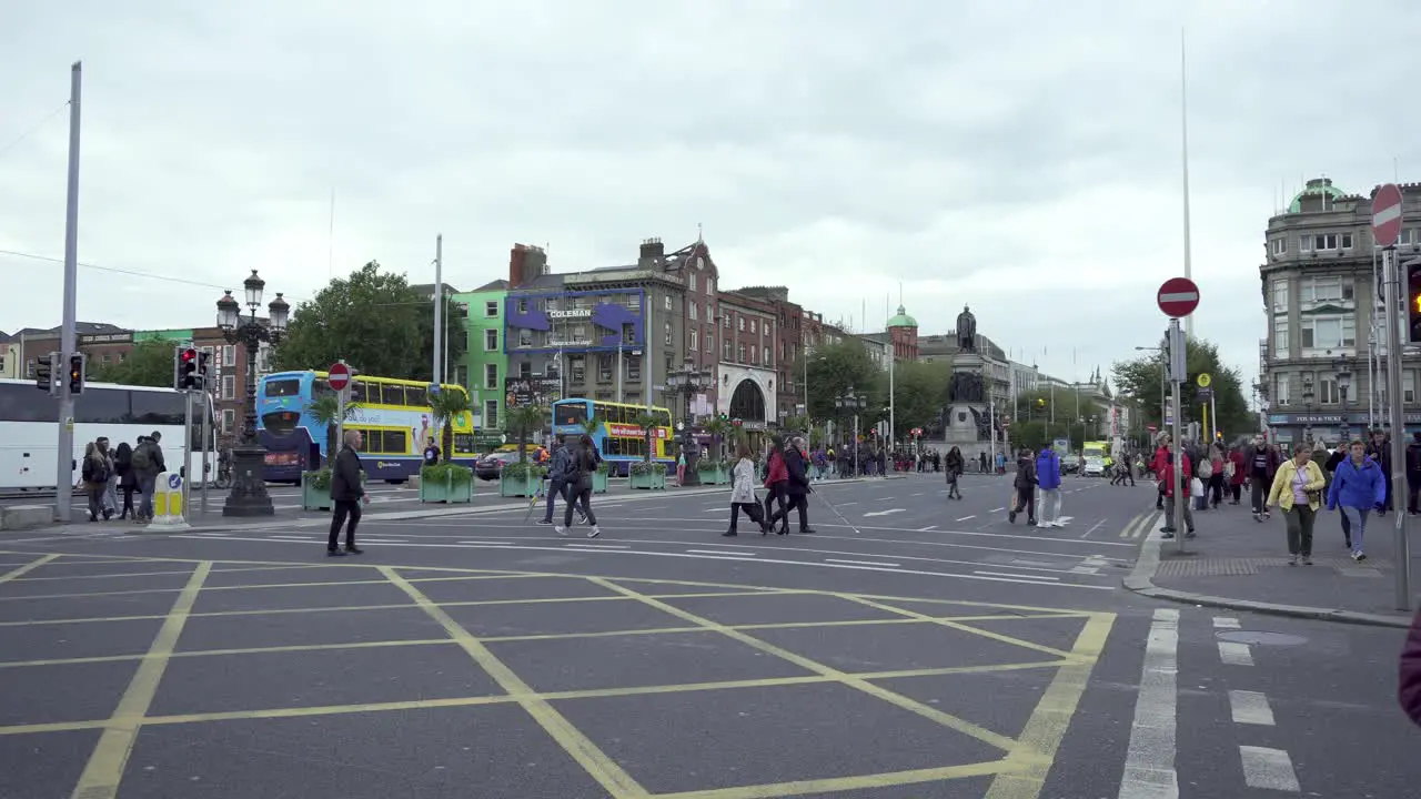 Crossing in Dublin city centre with pedestrians traffic and touristic buses