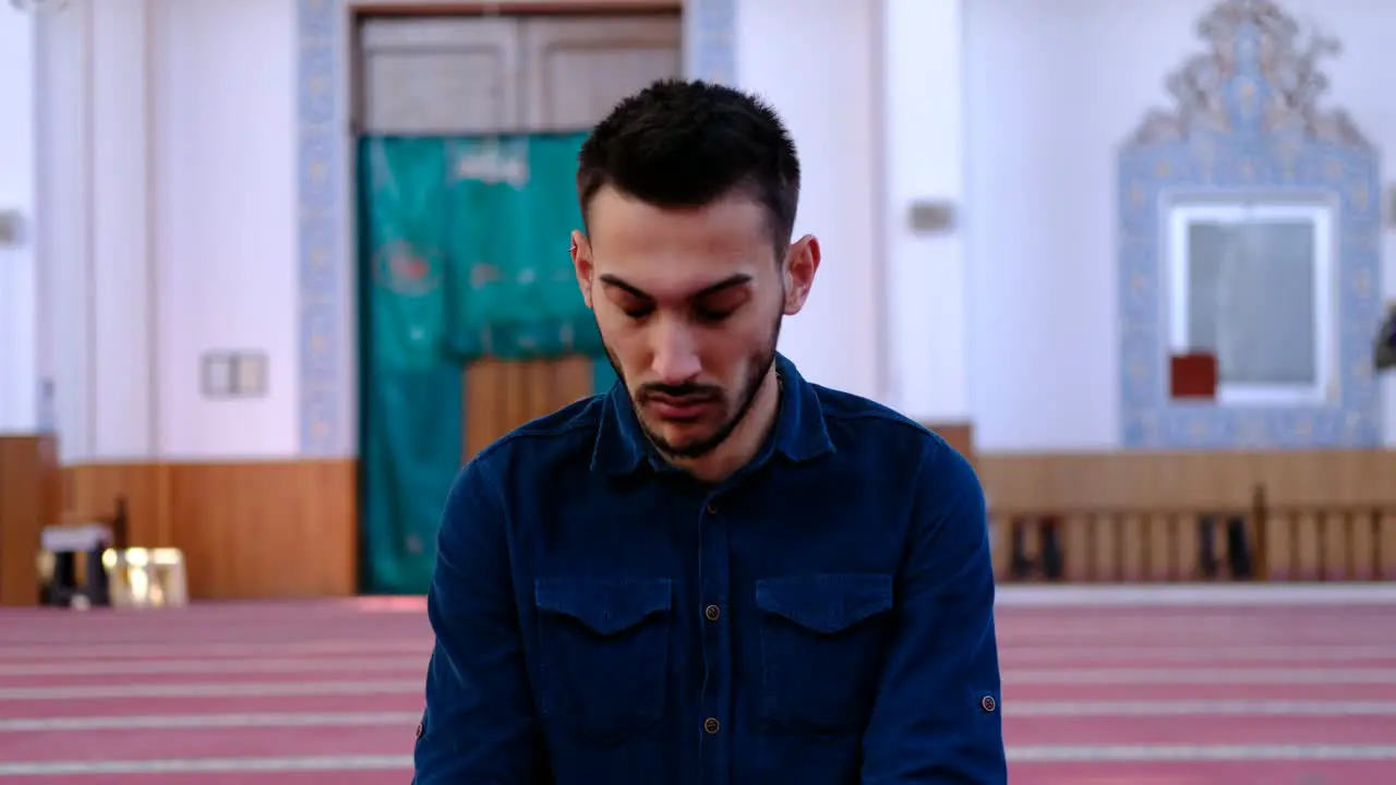 Man Turning His Head During Prayer In Mosque 1