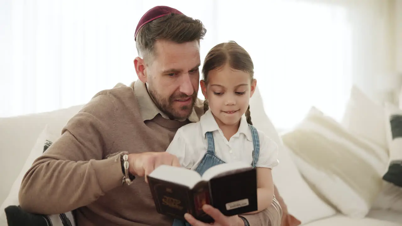 Reading book and father with girl in home